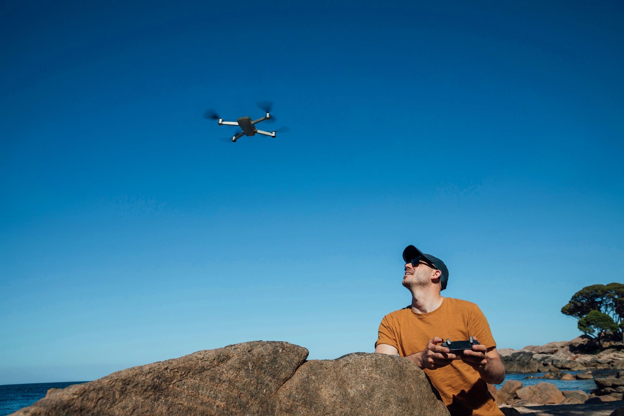 Drone operator preparing to capture aerial photos and video