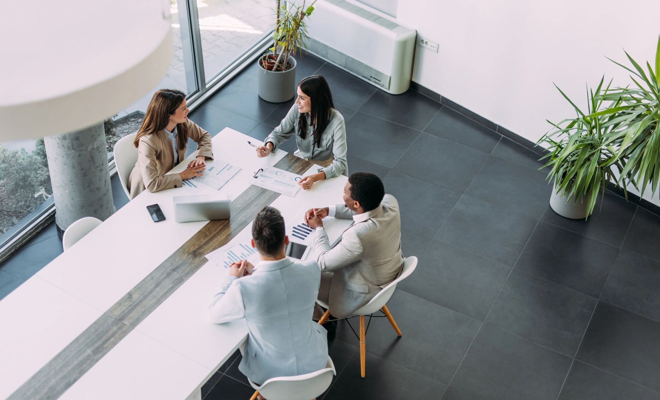 Fast Track Marketing team meeting with clients to plan a marketing project